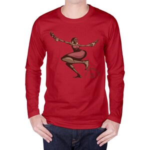 May include: A red long-sleeve shirt featuring a graphic of a dancing woman in a red dress and jewelry. The woman is depicted with brown skin and is in a dynamic pose. The shirt is worn by a person.