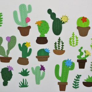 May include: A collection of 18 green, brown, and pink paper cutouts of cacti and succulents in various shapes and sizes. The cutouts are arranged on a white background.