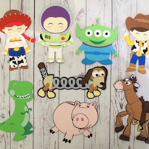 May include: A set of nine Toy Story character cutouts, including Woody, Buzz Lightyear, Jessie, Rex, Slinky Dog, Bullseye, Hamm, Alien, and Mr. Potato Head. The cutouts are made of colorful paper and are perfect for decorating a party or classroom.
