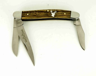 Rough Rider Stockman Knife with hand cut sterling silver whitetail inlay