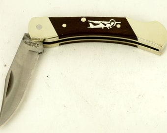 Schrade pocket knife with a custom sterling silver airplane inlay