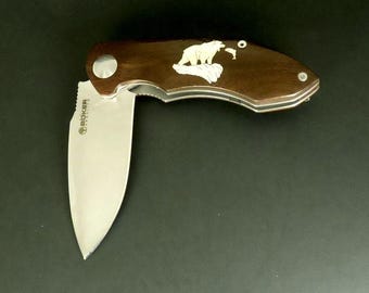 Boker knife with bear catching salmon inlay