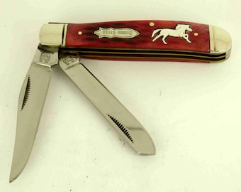 Rough Rider red bone trapper knife with Sterling Silver horse Inlay