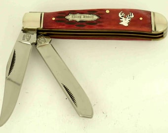 Rough Rider red bone trapper knife with Sterling Silver whitetail deer Inlay