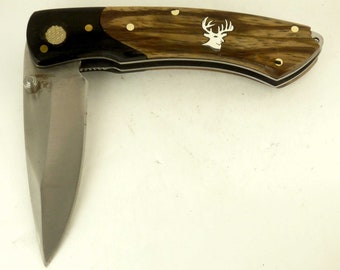 Rough Rider knife with Zebra wood handle and Custom sterling silver whitetail deer inlay