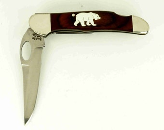 Bear and Son knife with hand cut sterling silver bear inlay