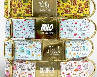May include: Customizable dog collars with gold-colored buckles. Designs include squirrels, hearts, treats, and text like "Lily," "Milo," "Stella," and "Cooper," along with phone numbers. The collars have various patterns and colors.