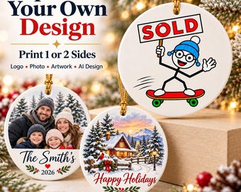 May include: Three round white ceramic ornaments with gold hanging strings. One features a stick figure on a skateboard holding a SOLD sign. Another shows a family photo with the text The Smith's 2026. The third displays a winter cabin scene with Happy Holidays.