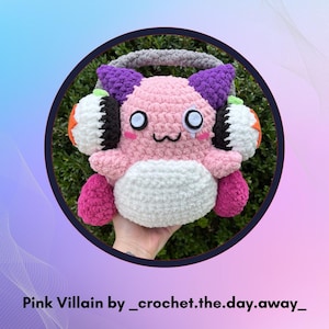 May include: A pink crochet creature with purple ears, white and black headphones, and a white belly. The creature has a grey handle and is surrounded by a black circle. The text "Pink Villain by _crochet.the.day.away_" is at the bottom.
