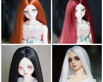 May include: Four different doll wigs in various colors, including red, orange, black, and white. The wigs are long and straight, and they are styled to look like human hair.