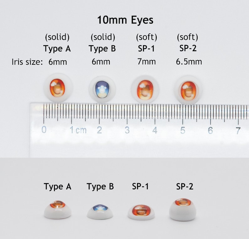 May include: Four pairs of 10mm doll eyes, two solid and two soft. The solid eyes are 6mm in diameter and the soft eyes are 7mm and 6.5mm in diameter. The eyes are arranged in two rows, with the solid eyes in the top row and the soft eyes in the bottom row. The eyes are all different colors and designs.