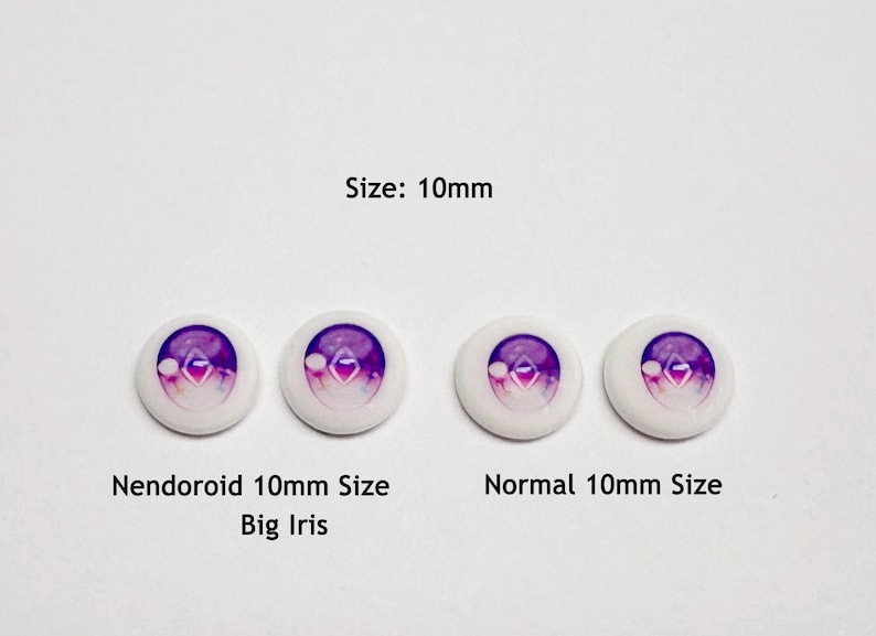 May include: Four circular doll eyes with a 10mm diameter, featuring a purple and white gradient iris with a central diamond shape. The text reads Size: 10mm, Nendoroid 10mm Size Big Iris, and Normal 10mm Size, labeling the two distinct eye styles.