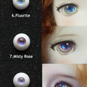 May include: Close-up of three doll eyes with different color variations. The eyes are labeled "6. Fluorite", "7. Misty Rose", and "9. Hydrangea". Each eye has a white sclera and a colorful iris, with the iris colors ranging from blue to purple.