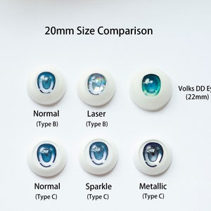 May include: A collection of six doll eyes arranged in two rows with the text 20mm Size Comparison. The eyes feature various blue iris designs labeled Normal Type B, Laser Type B, Normal Type C, Sparkle Type C, Metallic Type C, and Volks DD Eyes 22mm.