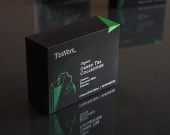 May include: A black box with a green accent on the top. The box is labeled "TeaVert. Organic Green Tea Collection" and lists the flavors "Jasmine, Moroccan Mint, Kukicha".