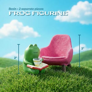 A miniature green frog figurine sitting on a tiny pink armchair reading a small book on a grassy field. Text reads 'Frog Figurine' and indicates the frog and chair are two separate pieces.