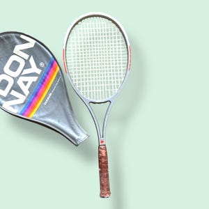 Donnay Vintage Braided Graphite Tennis Racket Silver with red accents and black rainbow cover | vintage tennis racket | racket wall decor