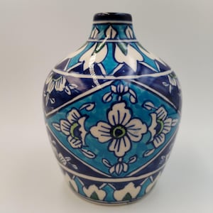 May include: A distressed wooden sign, inscribed with 'Welcome to our home' in white lettering. The sign has a rustic finish, ideal for adding a welcoming touch to any entrance.