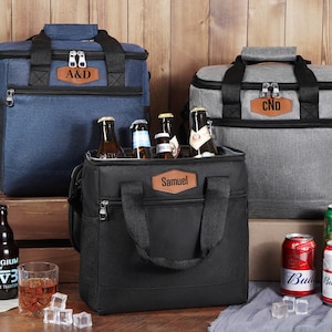 May include: A set of three ceramic mugs with a speckled, matte finish. The mugs are in shades of cream, light gray, and dark gray. Each mug has a simple, minimalist design and a rounded handle. The mugs are stacked on top of each other.