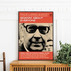 May include: A black and white poster with a red and white title that reads "PHILIP LARKIN QUINTET" and "MOANIN' ABOUT EVERYONE". The poster features a black and white photo of a man wearing glasses. The poster is framed in a black frame.