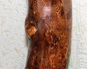 Wooden carved hanging vase on the wall