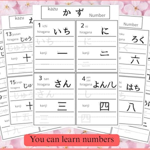 Könnte beinhalten: Weiße Karteikarten mit japanischen Schriftzeichen und Zahlen, einschließlich Hiragana und Kanji. Die Karten sind in einem Stapel angeordnet, mit dem Text "You can learn numbers" auf einem roten Banner unten.