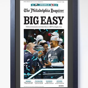 May include: Framed print of The Philadelphia Inquirer newspaper front page. Headline reads "BIG EASY" with a photo of the Super Bowl LIX champions. The image includes the text "SUPER BOWL CHAMPIONS LIX".