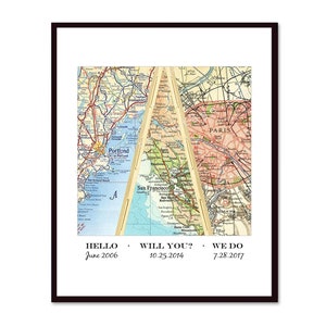 May include: A vintage map print with three sections, each showing a different city. The top section shows a map of Paris, the left section shows a map of Portland, and the right section shows a map of San Francisco. The text "HELLO June 2006", "WILL YOU? 10.25.2014", and "WE DO 7.28.2017" is printed below the map.