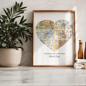 May include: A framed print with a heart-shaped collage of vintage maps. The text below the map reads "Journey of a Lifetime Bob & Trish".