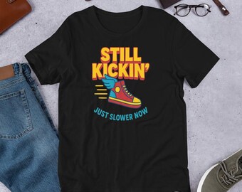 Still Kickin’ Just Slower Now T-Shirt – Funny Recovery Shirt for Survivors