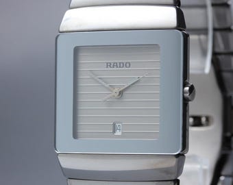 Reloj de hombre RADO Diastar 152.0332.3 con fecha, esfera plateada y movimiento de cuarzo, caja cuadrada, en perfecto estado.
