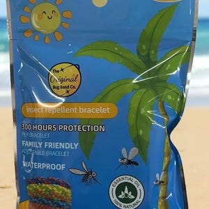May include: A pack of insect repellent bracelets. The blue packaging features a cartoon sun, palm tree, and the text "12 PACK". The bracelets are family-friendly, adjustable, and waterproof, offering 300 hours of protection per bracelet. The package also states the bracelets contain essential oil.