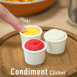Dispensador de condimentos - Juguete antiestrés mecánico impreso en 3D con forma de salsa (ketchup, mostaza, mayonesa), ideal para amantes de los snacks y como accesorio divertido para el escritorio.