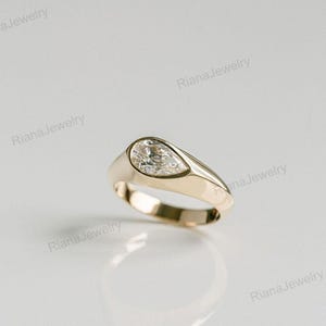 Bezel Set Pear Moissanite Ring: 14K Yellow Gold Solitaire