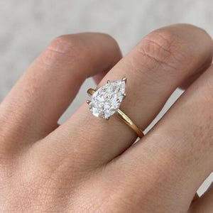 Handmade Pear Moissanite Engagement Ring: 14K Gold Hidden Halo