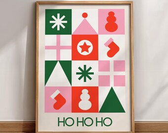 May include: A framed Christmas-themed print with a grid pattern of festive icons in green, red, and pink. The design includes snowflakes, a star, a snowman, and a stocking. The words "HO HO HO" are printed at the bottom.