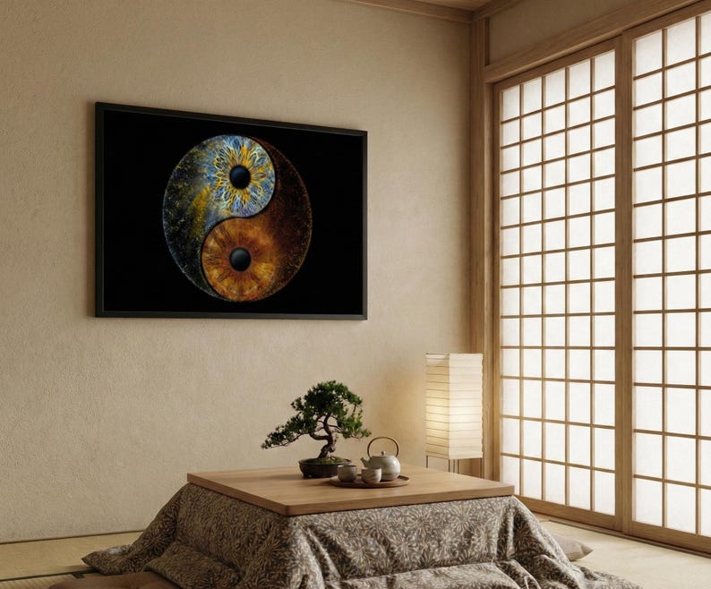 May include: A rectangular wall art print featuring a yin and yang symbol composed of two human irises. The top half is a blue and yellow iris, while the bottom half is a brown iris. The artwork is set against a solid black background and framed.