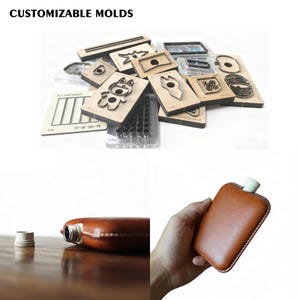May include: A selection of wooden and metal crafting molds in various shapes and designs. The image also shows a brown leather flask with a silver cap and a brown leather flask being held.