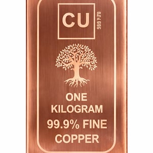 May include: A copper bar with rounded corners, featuring the element symbol 'CU' and a tree design. The bar is labeled 'ONE KILOGRAM' and '99.9% FINE COPPER'. The bar has a serial number and is a reddish-brown color.