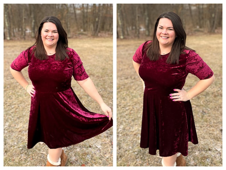 Pode incluir: Uma mulher vestindo um vestido de veludo vinho com mangas curtas e saia rodada. Ela est&aacute; em p&eacute; em uma &aacute;rea gramada com &aacute;rvores ao fundo.