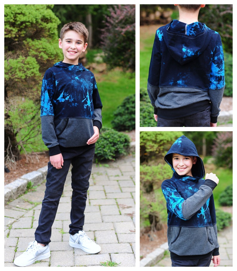 May include: A blue and gray hooded sweatshirt with a tie-dye pattern. The sweatshirt has a kangaroo pocket and a drawstring hood.