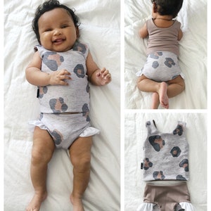 May include: A two-piece swimsuit for babies with a grey and brown leopard print. The top is sleeveless and the bottom has a ruffle trim.