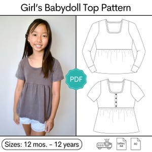 May include: A sewing pattern for a babydoll top with sizes 12 mos. - 12 years. The image shows a brown short-sleeved top and two black and white line drawings of the top with long and short sleeves, a square neckline, and a gathered waist.