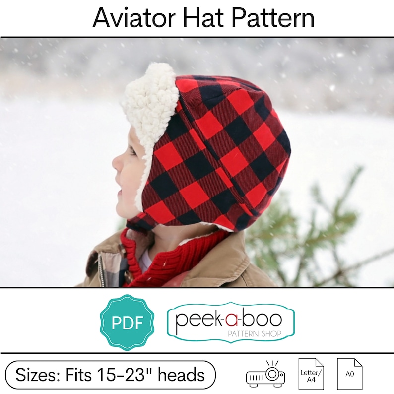May include: A PDF pattern for a red and black plaid aviator hat with a white faux fur trim. The pattern is for sizes 15-23" heads. The pattern is available from peek-a-boo PATTERN SHOP.