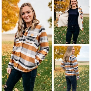 May include: A brown, white, and black plaid flannel shirt with a sherpa lining. The shirt has a button-up front and two pockets. The model is wearing the shirt with black jeans.