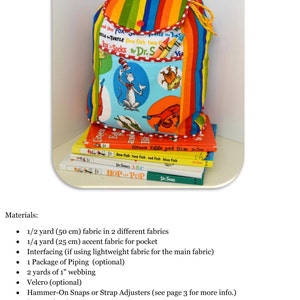 May include: A colorful, striped fabric backpack with a pocket featuring a Dr. Seuss character. The backpack is stacked on top of several Dr. Seuss books. The text on the books includes "One Fish Two Fish Red Fish Blue Fish", "Green Eggs and Ham", and "Hop on Pop".