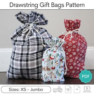May include: Three drawstring gift bags in various sizes and patterns. One bag is black and white plaid, another is red with white snowflakes, and the smallest is light blue with a winter scene. The bags are tied with white cords. The text "Drawstring Gift Bags Pattern" is at the top.