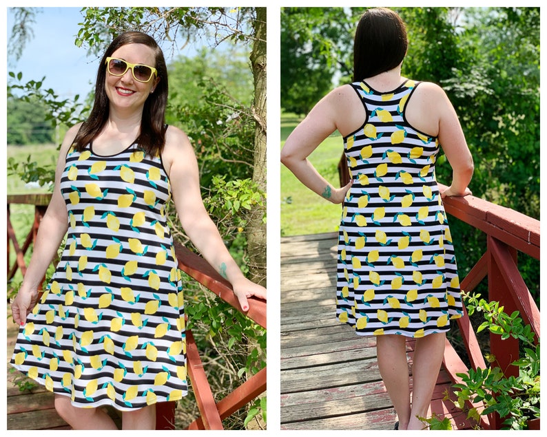 May include: A black and white striped sleeveless dress with a lemon print. The dress has a scoop neck and a flowy skirt.