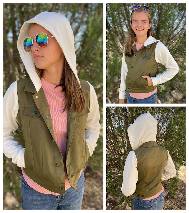 May include: An olive green hooded vest with white sleeves and a white hood. The vest has a button-up front and two chest pockets. The person is wearing a pink shirt and blue jeans. The person is wearing sunglasses.