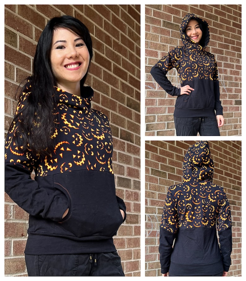 May include: A black and orange hoodie with a pumpkin face pattern on the top half and a solid black bottom half. The hoodie has a hood and a kangaroo pocket.